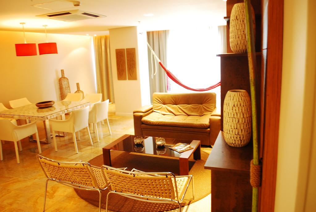 Ghl Hotel Monteria Room photo A living room in a typical apartment